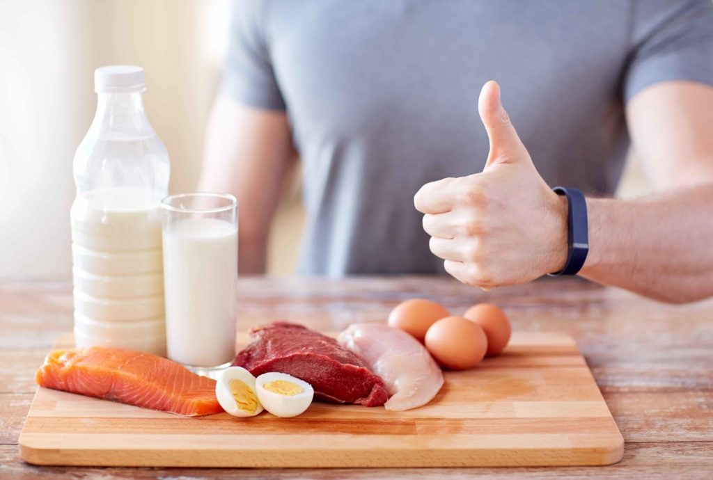 Man with protein and thumbs up